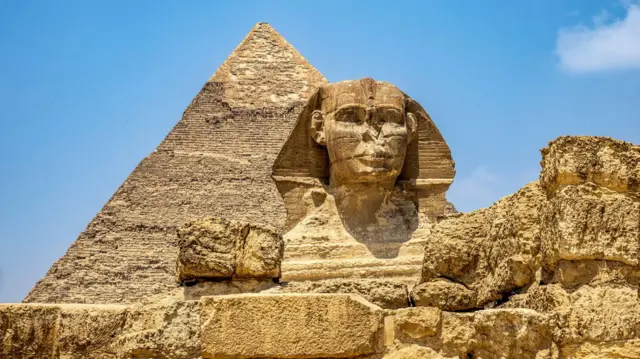 The Great Sphinx and behind it the pyramid of King Khafre of the Fourth Dynasty
